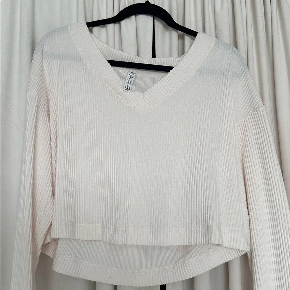 ALO Yoga Ribbed V-Neck Cropped Sweatshirt in Cream - Picture 6 of 7
